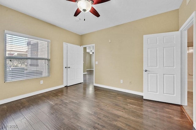 unfurnished bedroom with a ceiling fan, baseboards, and wood finished floors