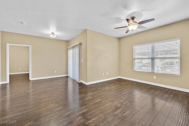 unfurnished room featuring dark wood-style floors, baseboards, and a ceiling fan