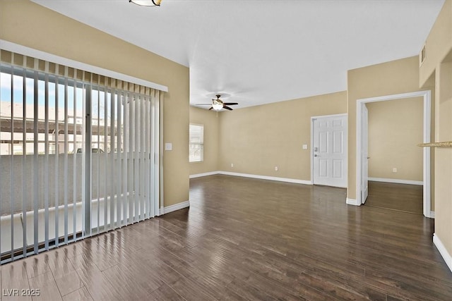 unfurnished living room with visible vents, baseboards, a ceiling fan, and wood finished floors