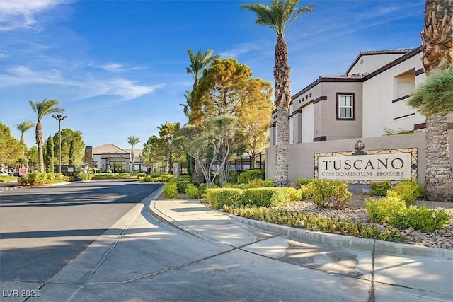 view of street with curbs and a residential view