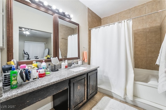 full bathroom with tile patterned flooring, vanity, shower / bathtub combination with curtain, and ceiling fan