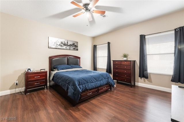 bedroom with ceiling fan, baseboards, and wood finished floors