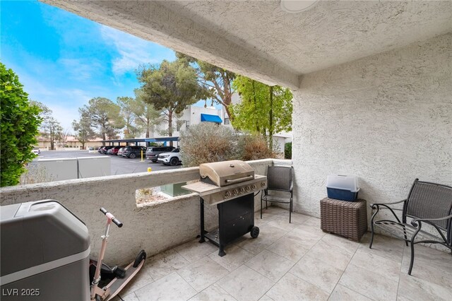 view of patio featuring a grill