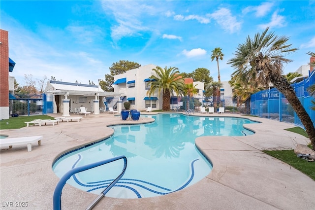 pool featuring a patio and fence