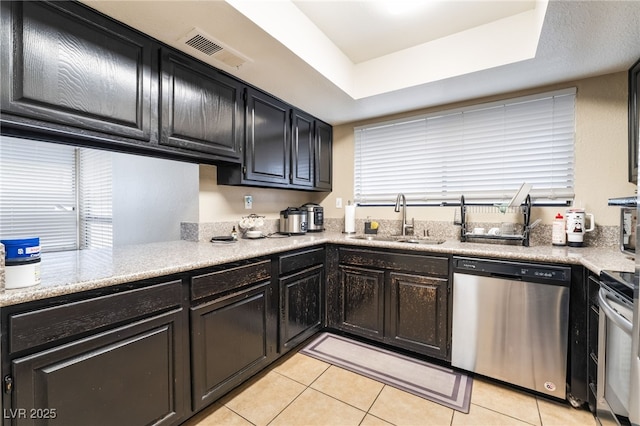 kitchen with visible vents, light tile patterned flooring, a sink, light countertops, and appliances with stainless steel finishes