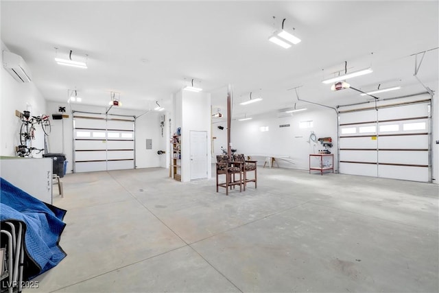 garage with a garage door opener and a wall unit AC