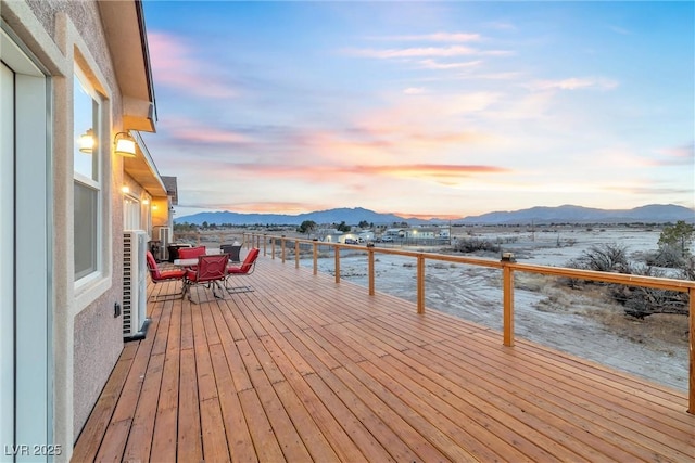 wooden deck featuring a mountain view