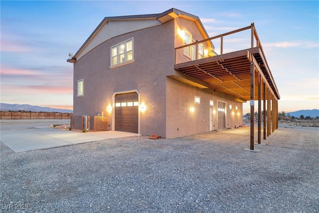 view of front facade featuring stucco siding, a garage, and concrete driveway