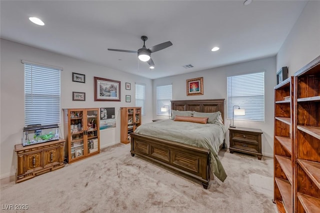 carpeted bedroom featuring recessed lighting, visible vents, ceiling fan, and baseboards