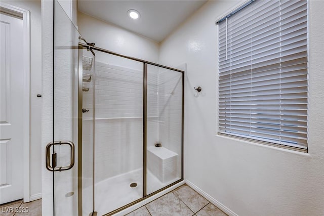 full bathroom featuring recessed lighting, a shower stall, and tile patterned flooring