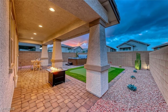 view of patio / terrace with a fenced backyard and an outdoor fire pit