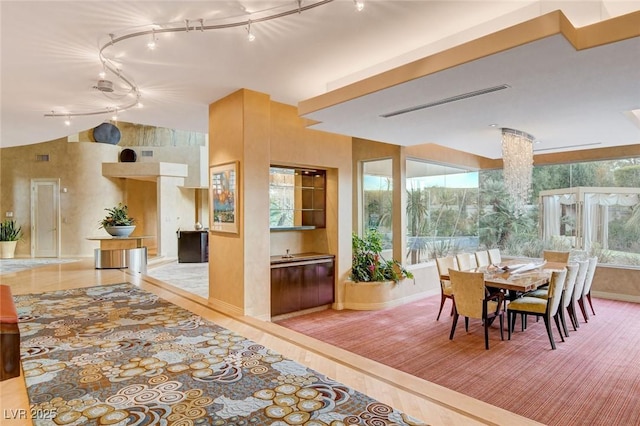 dining room featuring vaulted ceiling