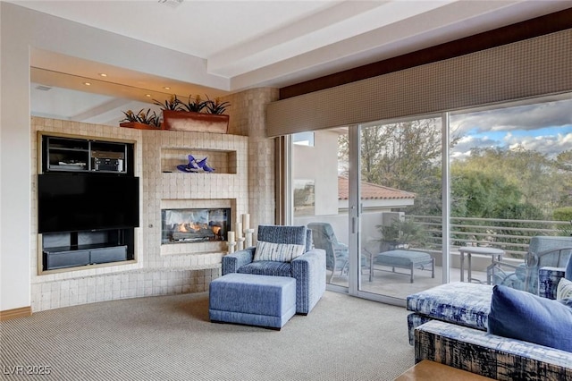 carpeted living area featuring a multi sided fireplace