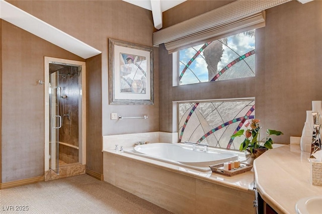 full bathroom featuring vanity, a bath, and a shower stall