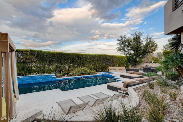 view of swimming pool featuring a patio and a fenced in pool