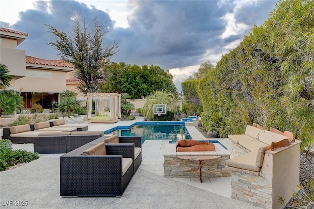 outdoor pool featuring an outdoor living space and a patio area