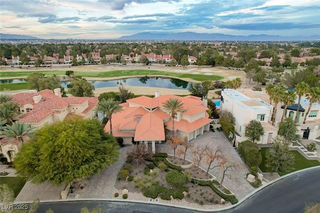 bird's eye view featuring a residential view and a water and mountain view