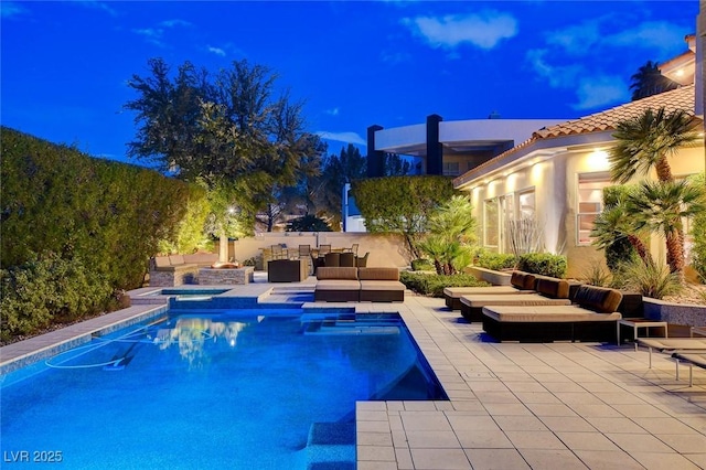 view of pool featuring a patio area, a fenced in pool, and an outdoor hangout area