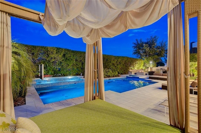 view of swimming pool featuring a patio area, an outdoor living space, and a pool with connected hot tub