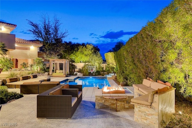 outdoor pool featuring an outdoor hangout area and a patio area