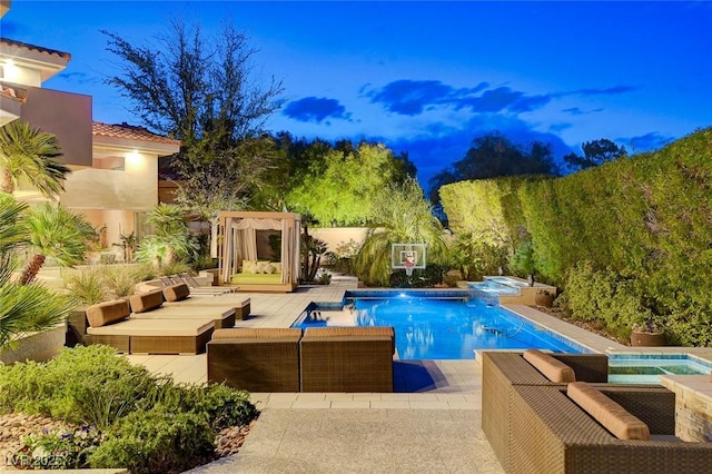 outdoor pool with an outdoor living space, an in ground hot tub, and a patio