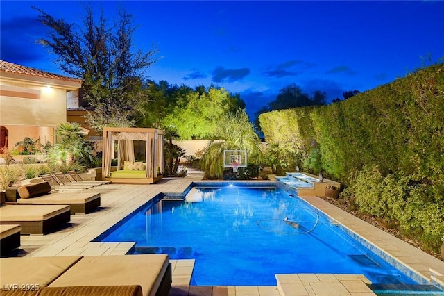 view of swimming pool featuring a patio area and a pool with connected hot tub