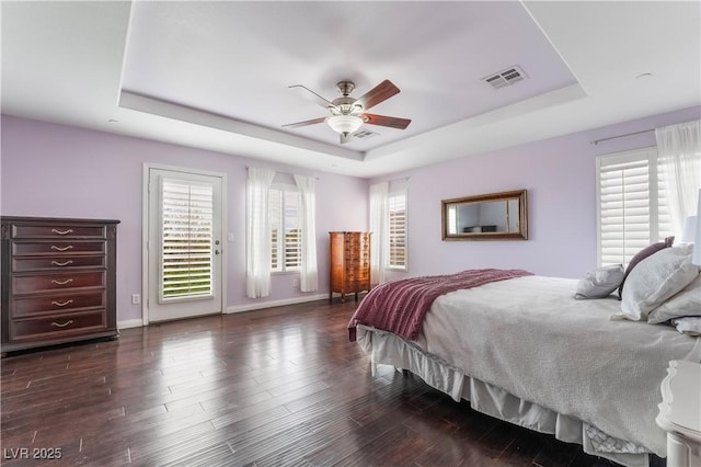 872 Timber Walk Dr, Henderson, NV 89052 - bedroom featuring visible vents, dark wood-type flooring, and a tray ceiling