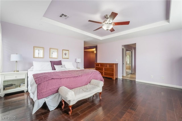 872 Timber Walk Dr, Henderson, NV 89052 - bedroom with a tray ceiling, baseboards, visible vents, and wood finished floors