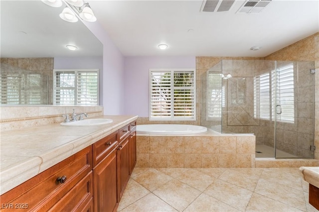 872 Timber Walk Dr, Henderson, NV 89052 - bathroom featuring tile patterned flooring, visible vents, a shower stall, a garden tub, and vanity