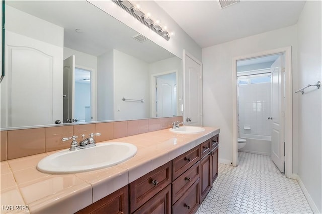 872 Timber Walk Dr, Henderson, NV 89052 - full bath with toilet, baseboards, visible vents, and a sink