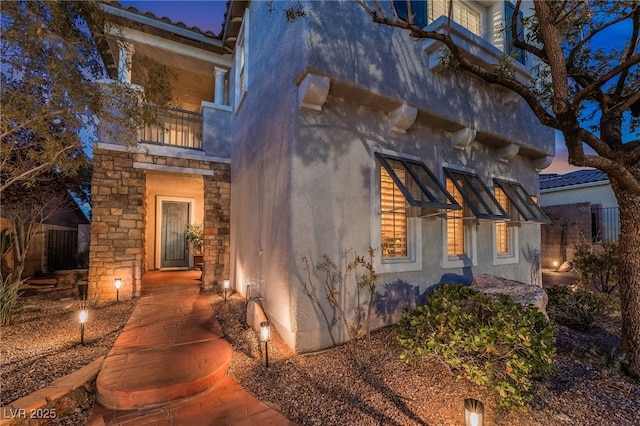 872 Timber Walk Dr, Henderson, NV 89052 - view of side of property with stucco siding and a balcony