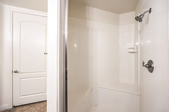 full bathroom featuring tile patterned flooring and walk in shower