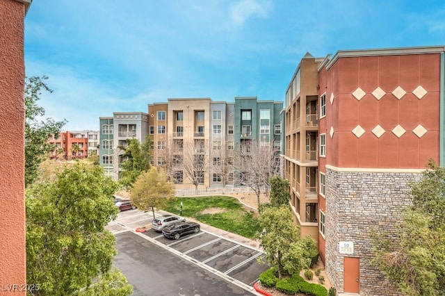 view of property with uncovered parking