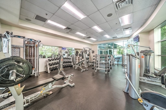 workout area featuring visible vents and a drop ceiling