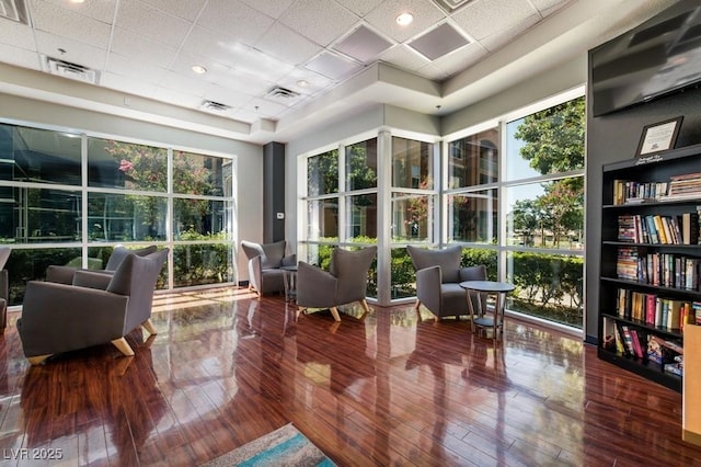 interior space with visible vents and a paneled ceiling