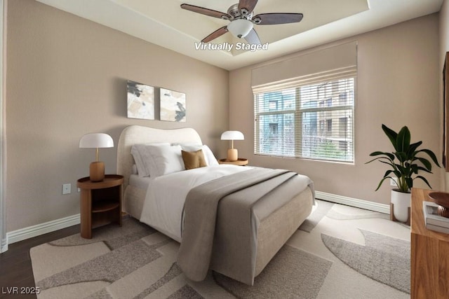 56 E Serene Ave Unit 306, Las Vegas, NV 89123 - bedroom with baseboards, ceiling fan, and wood finished floors