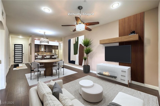 56 E Serene Ave Unit 306, Las Vegas, NV 89123 - living room featuring baseboards, a ceiling fan, a chandelier, dark wood finished floors, and recessed lighting