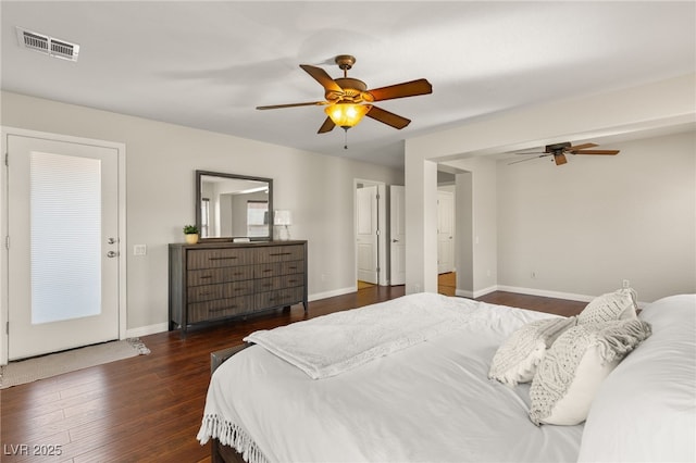 bedroom with visible vents, ceiling fan, dark wood-type flooring, and baseboards