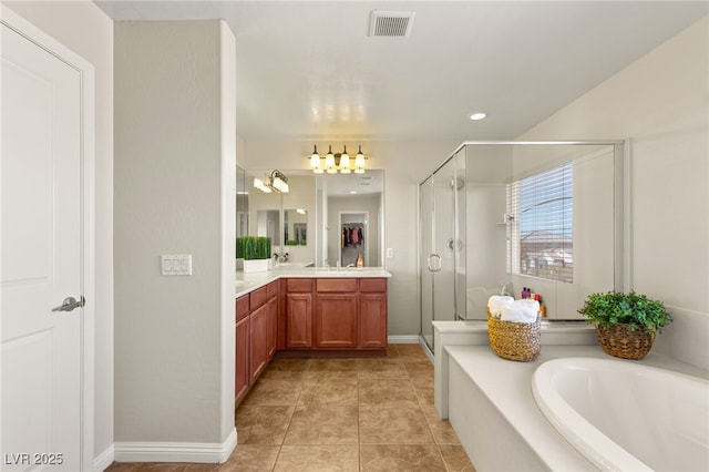 bathroom featuring visible vents, double vanity, a stall shower, tile patterned floors, and a bath