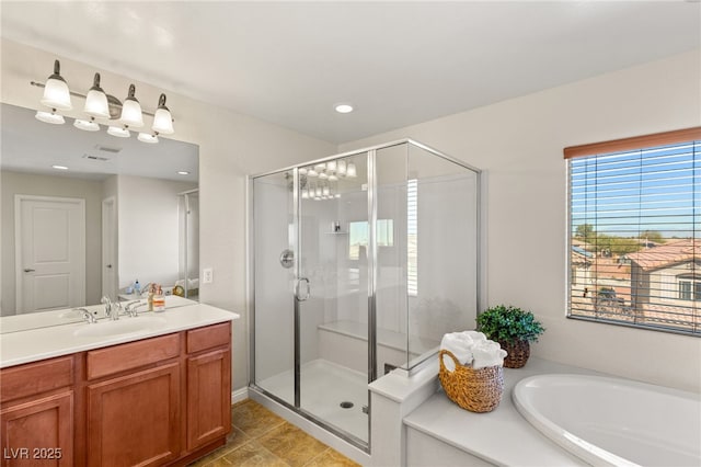 full bath featuring visible vents, a shower stall, vanity, and a garden tub