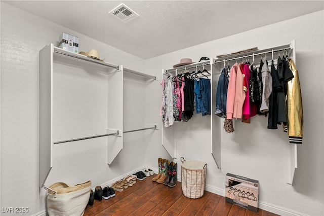 spacious closet with hardwood / wood-style floors and visible vents