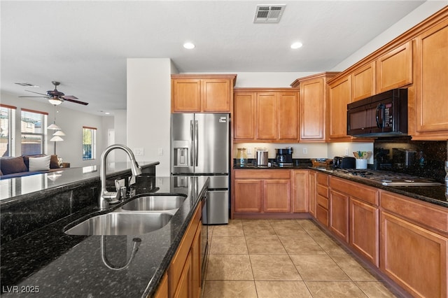 kitchen featuring visible vents, ceiling fan, light tile patterned floors, stainless steel appliances, and a sink