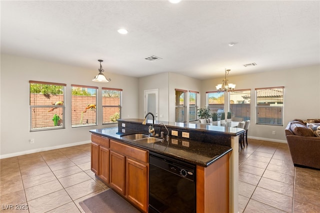 kitchen with visible vents, a chandelier, dishwasher, brown cabinetry, and a sink