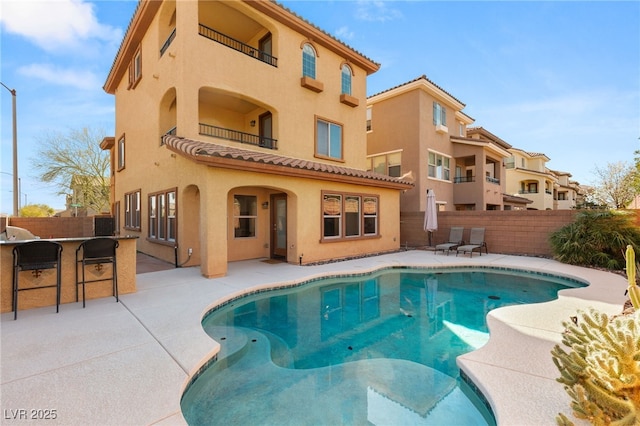 view of pool with a patio area, a fenced in pool, and a fenced backyard