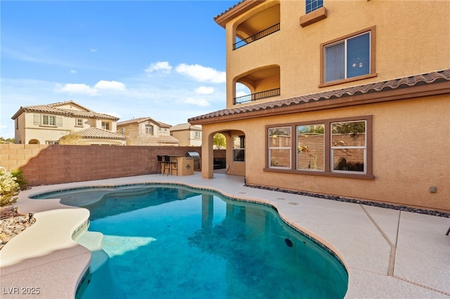 view of swimming pool with a fenced in pool, a patio area, fence, and grilling area