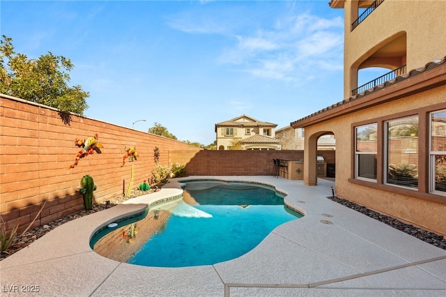 view of swimming pool featuring a fenced in pool, a fenced backyard, and a patio area