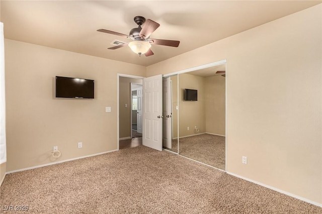 unfurnished bedroom with visible vents, ceiling fan, baseboards, carpet, and a closet