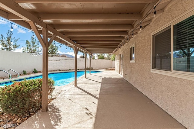 view of pool featuring a patio, a fenced backyard, and a fenced in pool