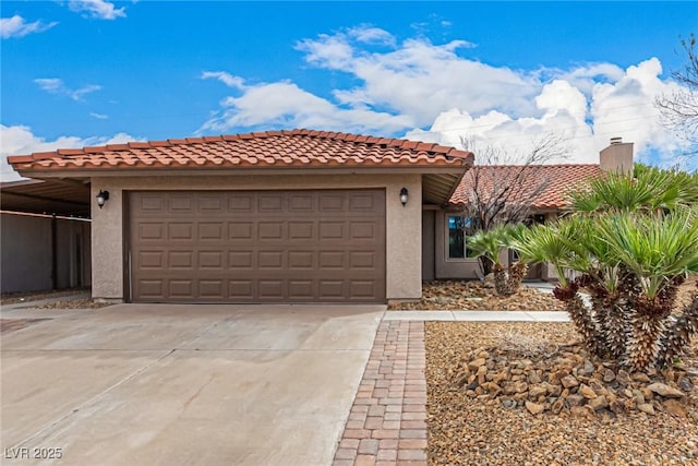 mediterranean / spanish home featuring a tile roof, an attached garage, driveway, and stucco siding