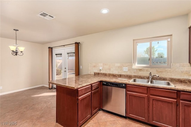 kitchen featuring visible vents, a sink, stainless steel dishwasher, french doors, and a peninsula